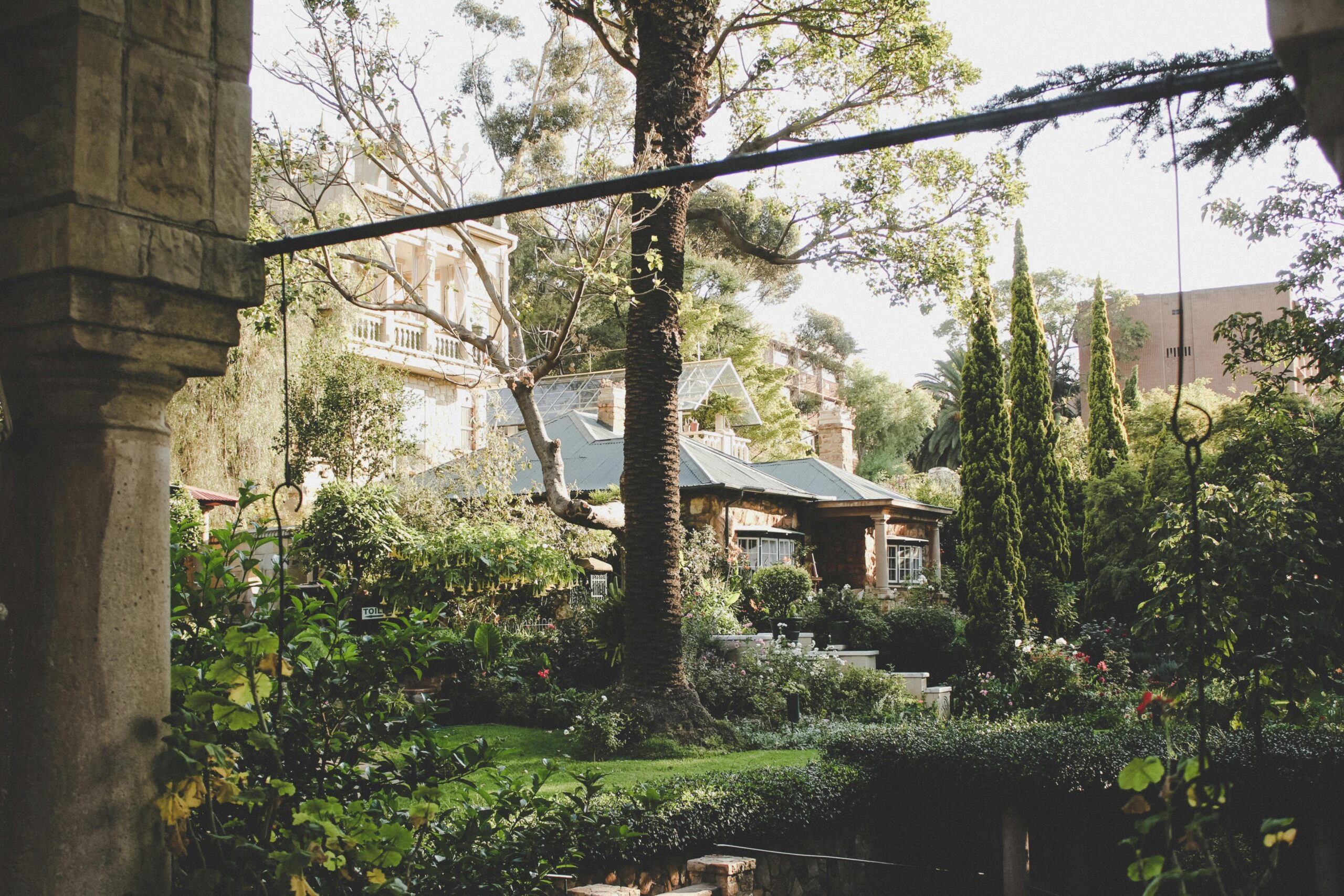 A charming 18th-century stone cottage nestled among lush greenery