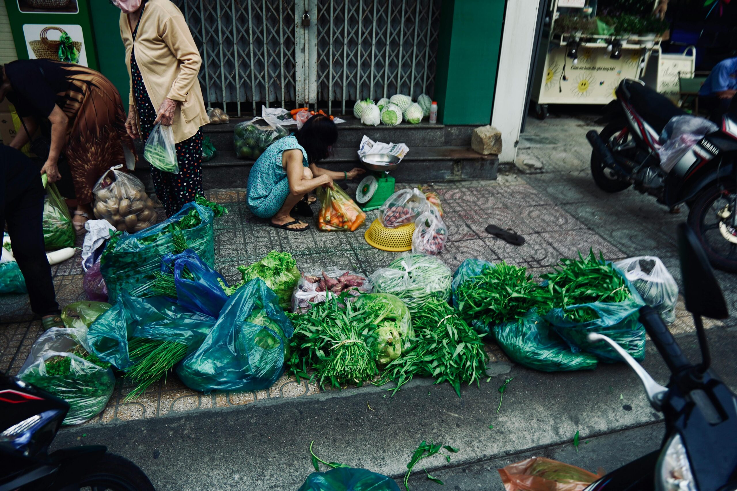 A bustling market scene with colorful produce stalls and smiling vendors wearing traditional clothing