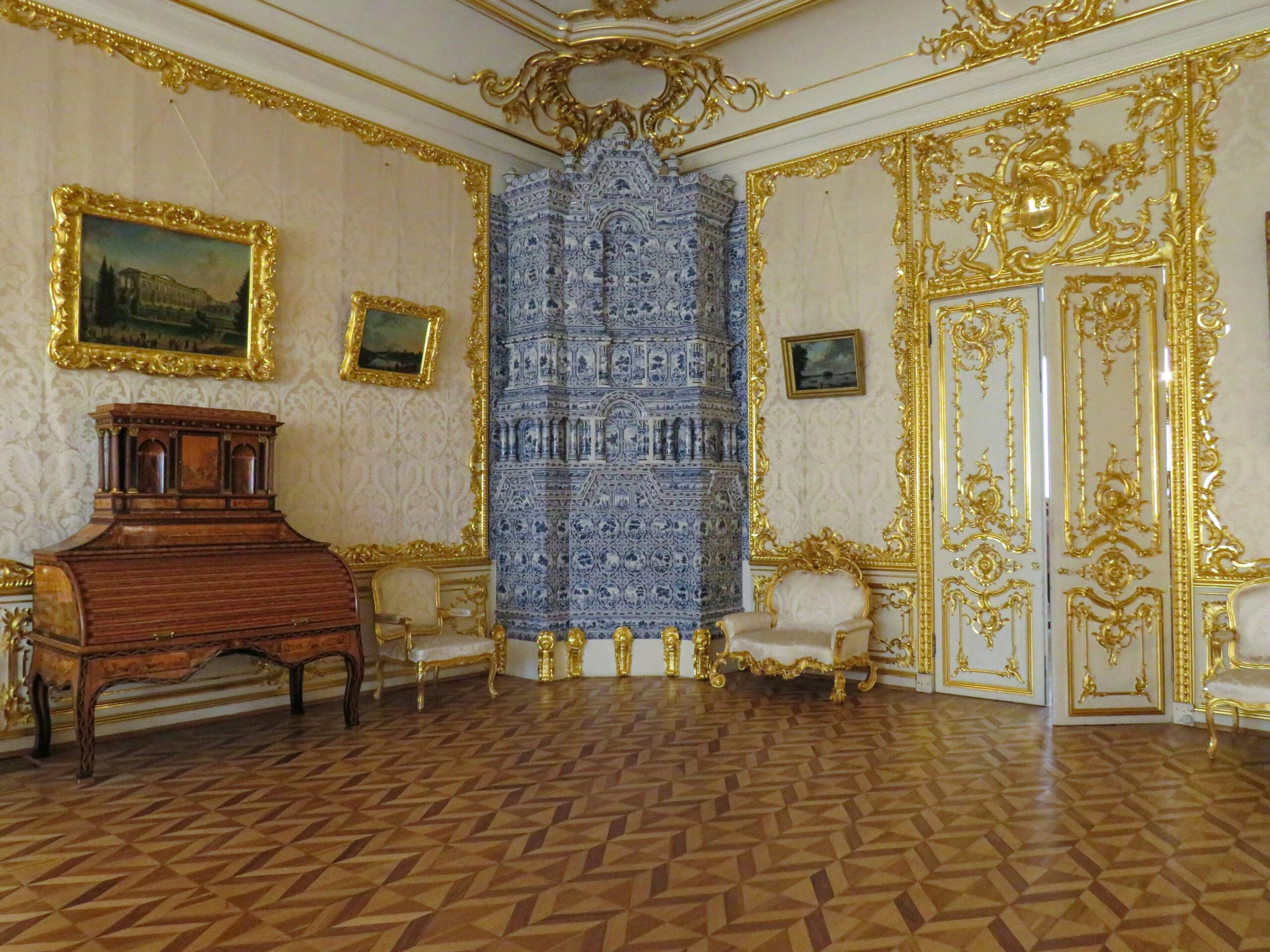 A cozy bedroom with ornate furniture inside a historic villa