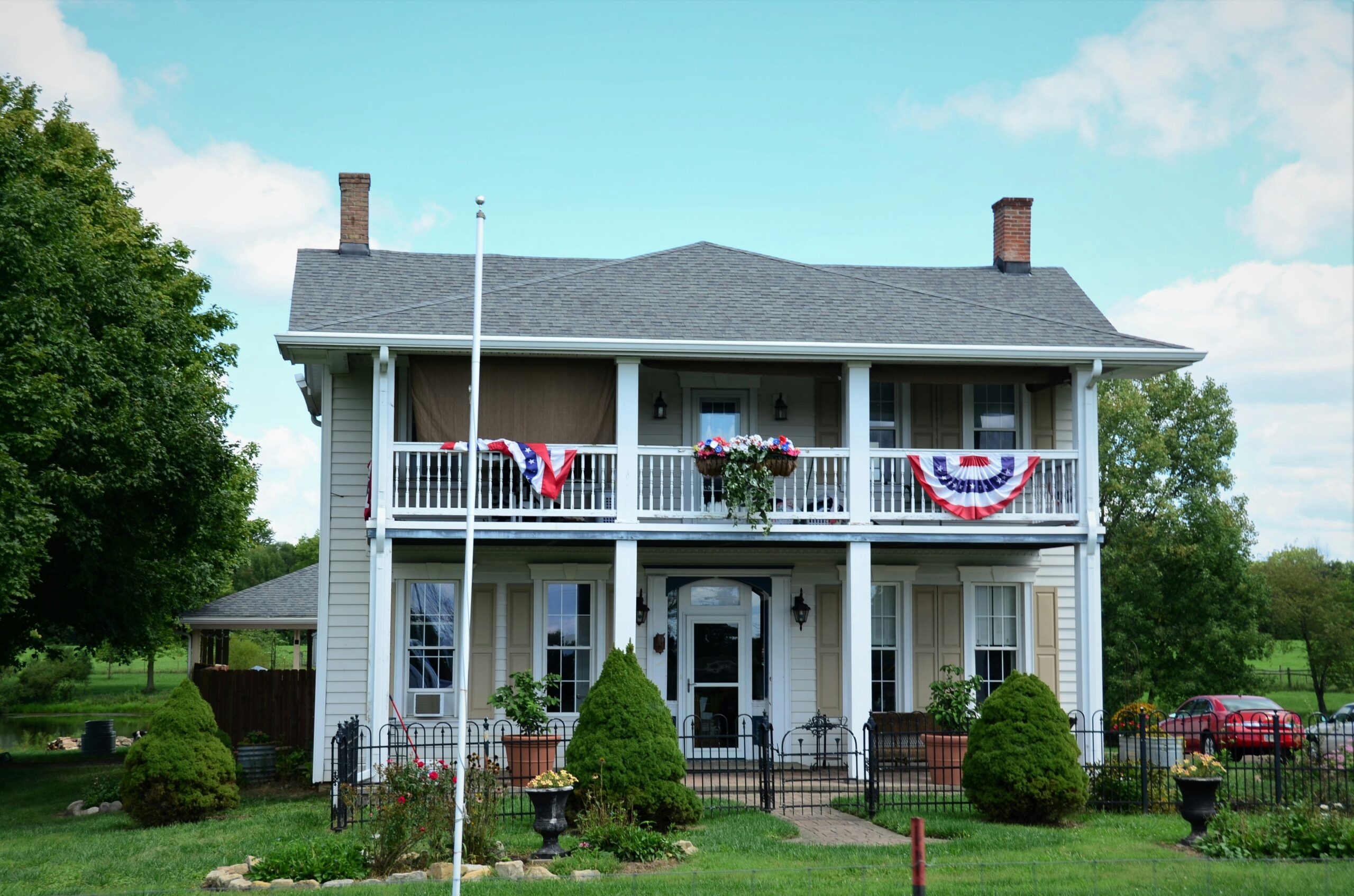 A quaint historic village with cobblestone streets leading to a beautifully preserved inn.