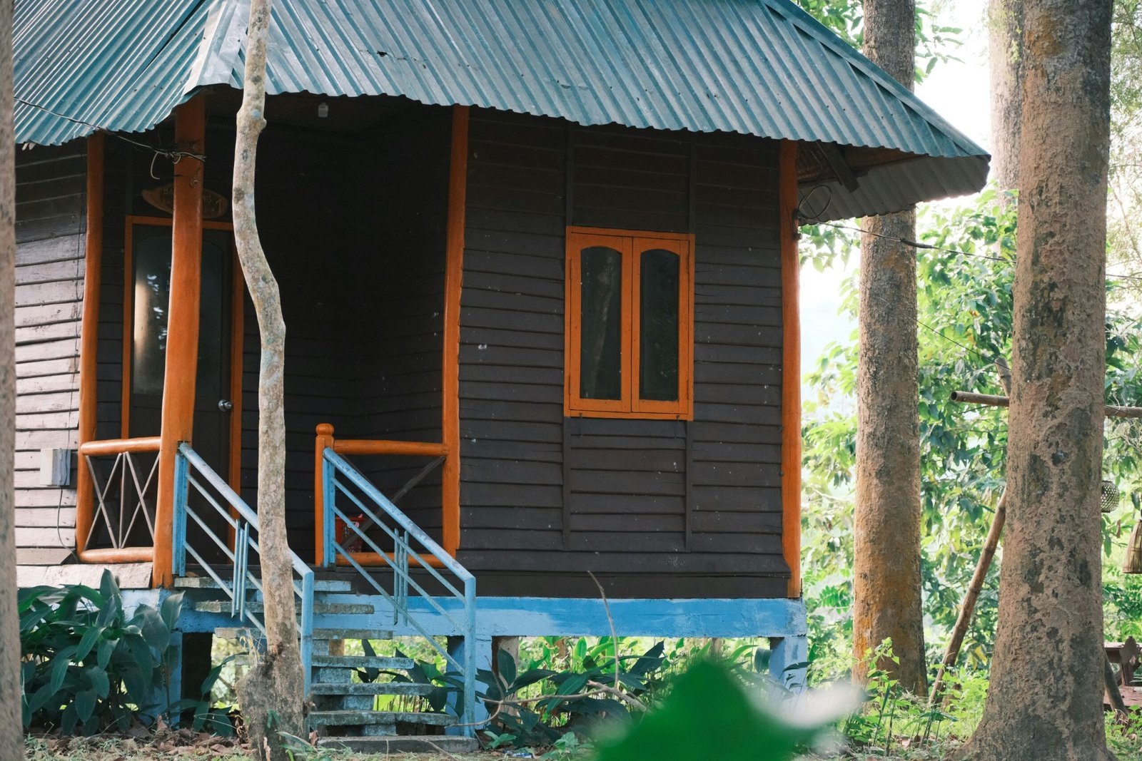 Antique bedroom featuring a four-poster bed and oil lamp lighting