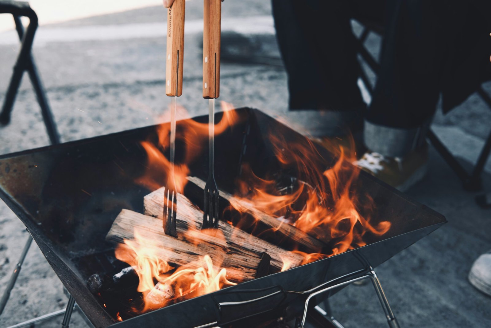 Cooking over campfire at sunset