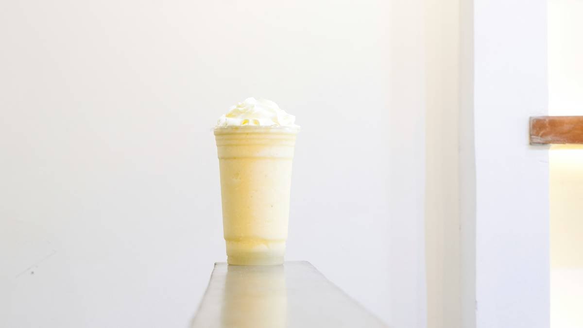 A retro kitchen setup with a mint green refrigerator and chrome appliances