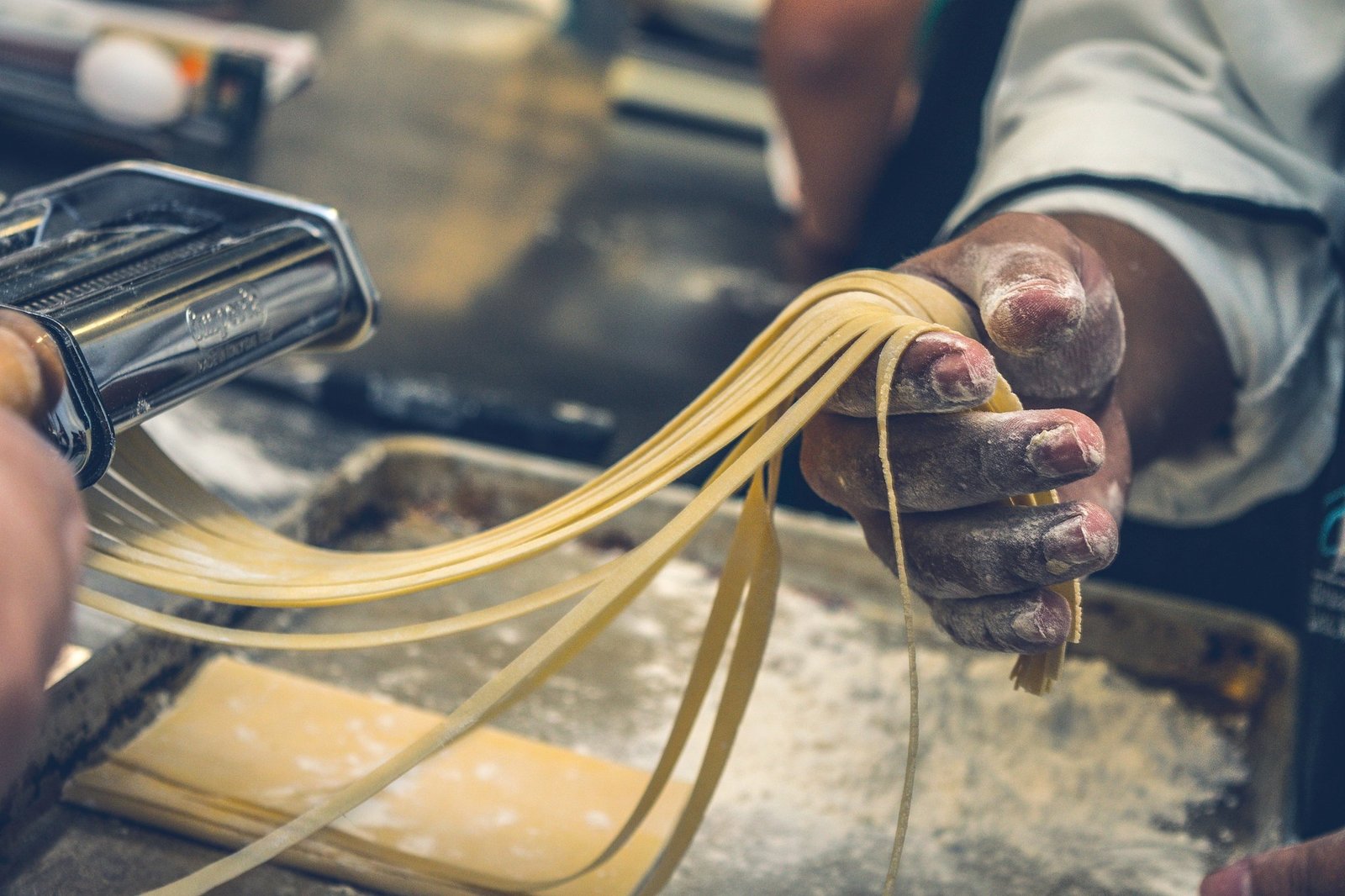 A group learning traditional pasta-making in Italy