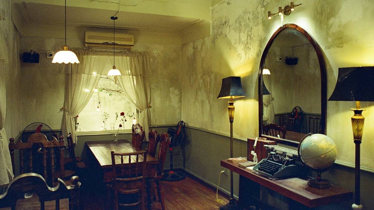 A cozy interior featuring antique furniture and roaring fireplace