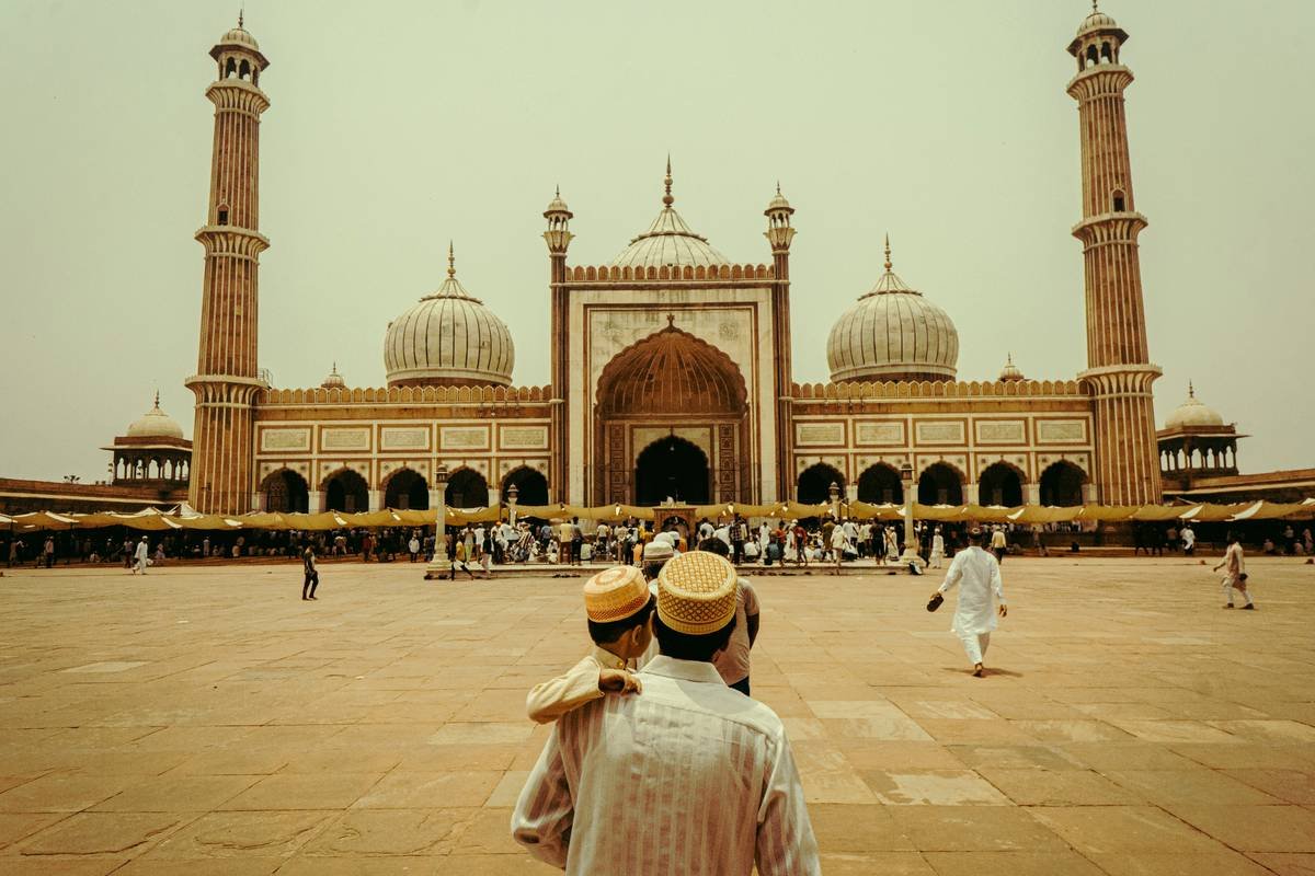 A cozy stone-built croft house surrounded by misty highland scenery