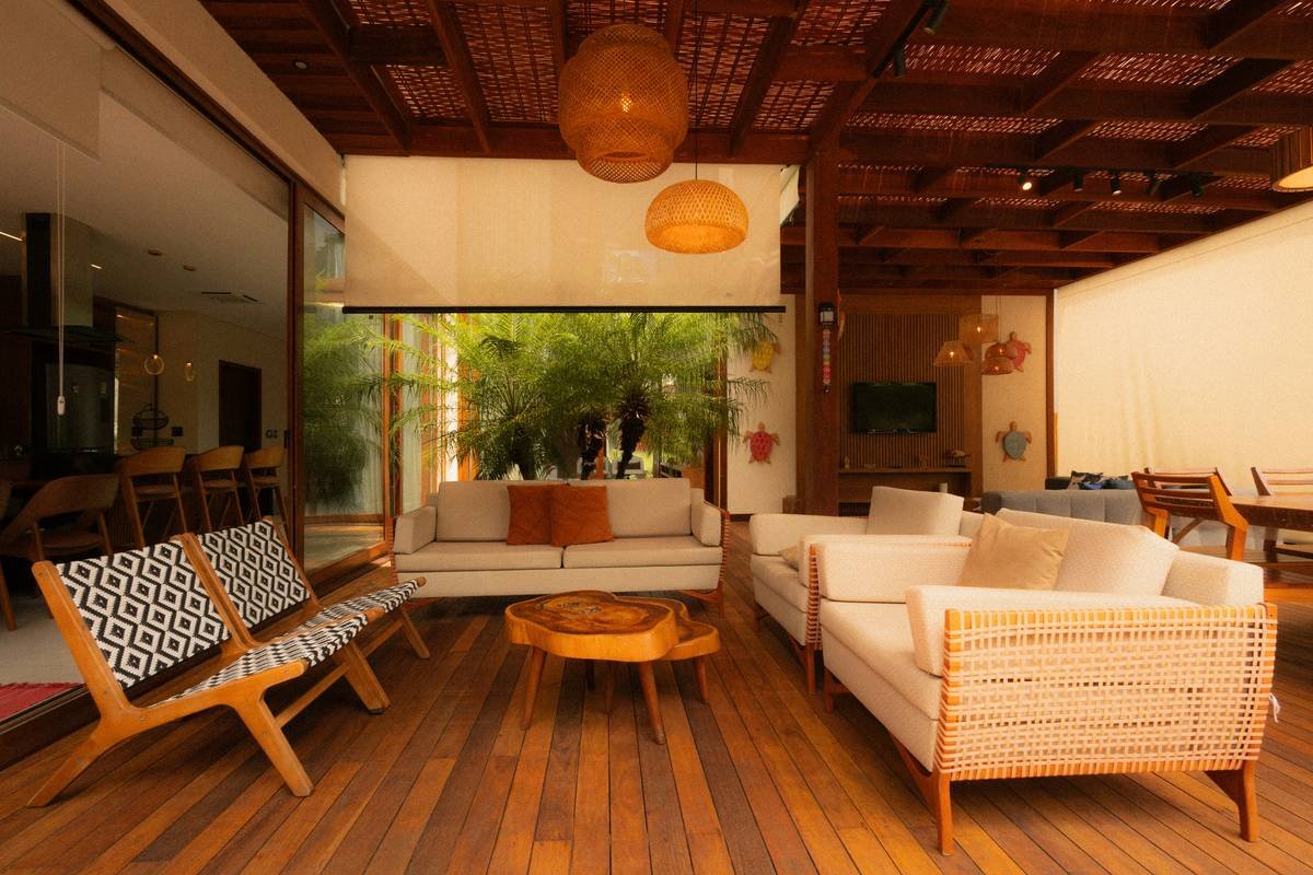 A Scottish tower house vacation rental surrounded by lush greenery and rolling hills.