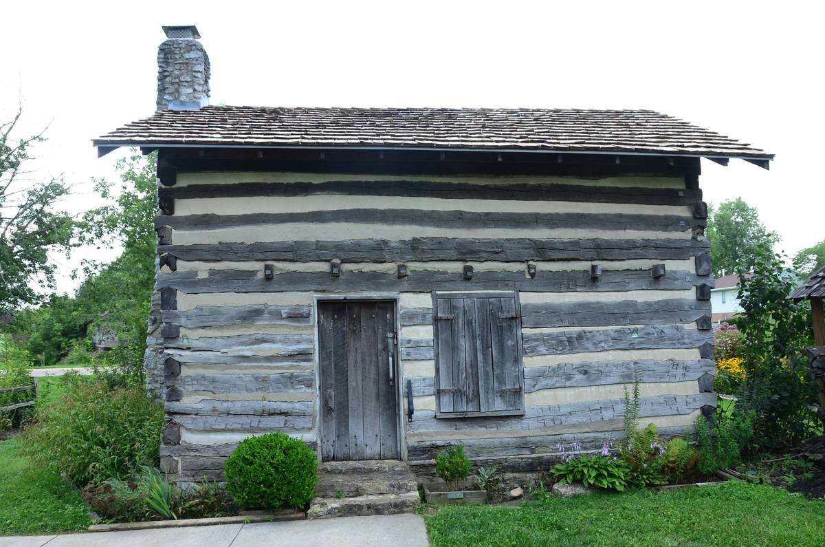 A stunning historic stone cottage nestled amidst greenery