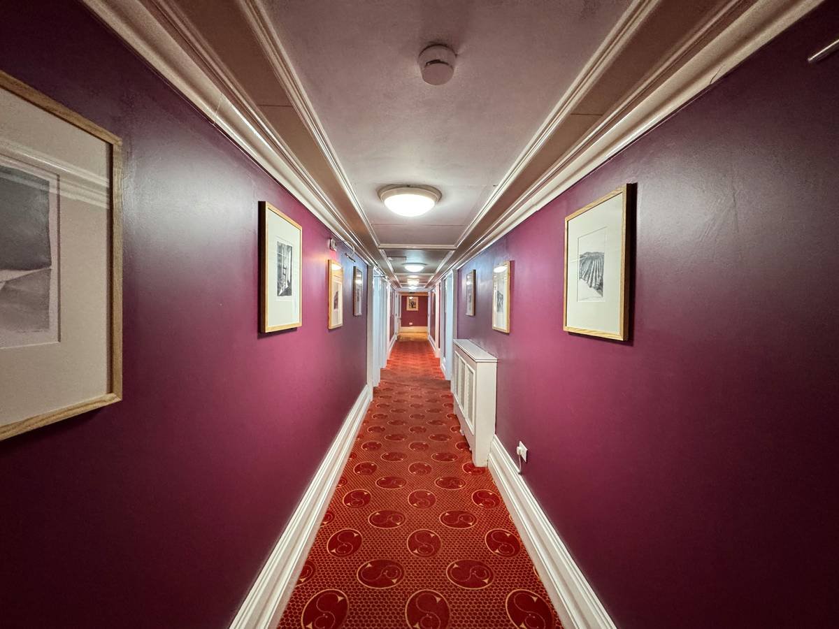 Exterior view of an ancient building with arched windows