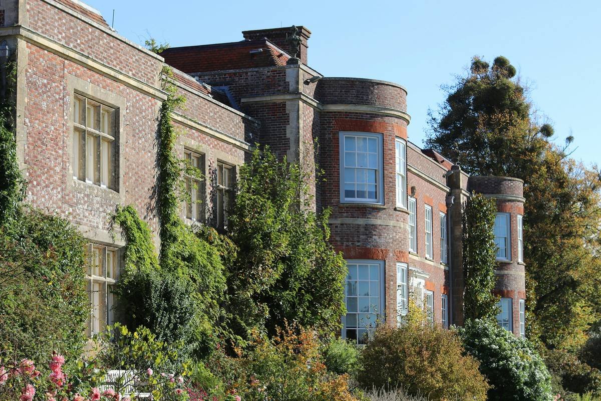Photo showing stark contrast between sterile modern rental and cozy heritage manor interior