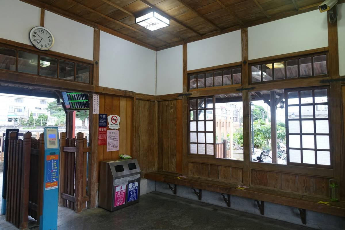 Interior of a cozy, historic vacation rental featuring vintage furniture and warm lighting.