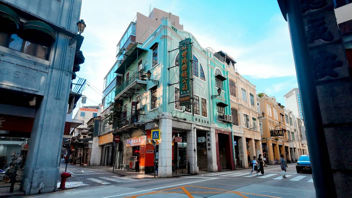 Exterior view of a charming heritage stay bungalow surrounded by lush greenery