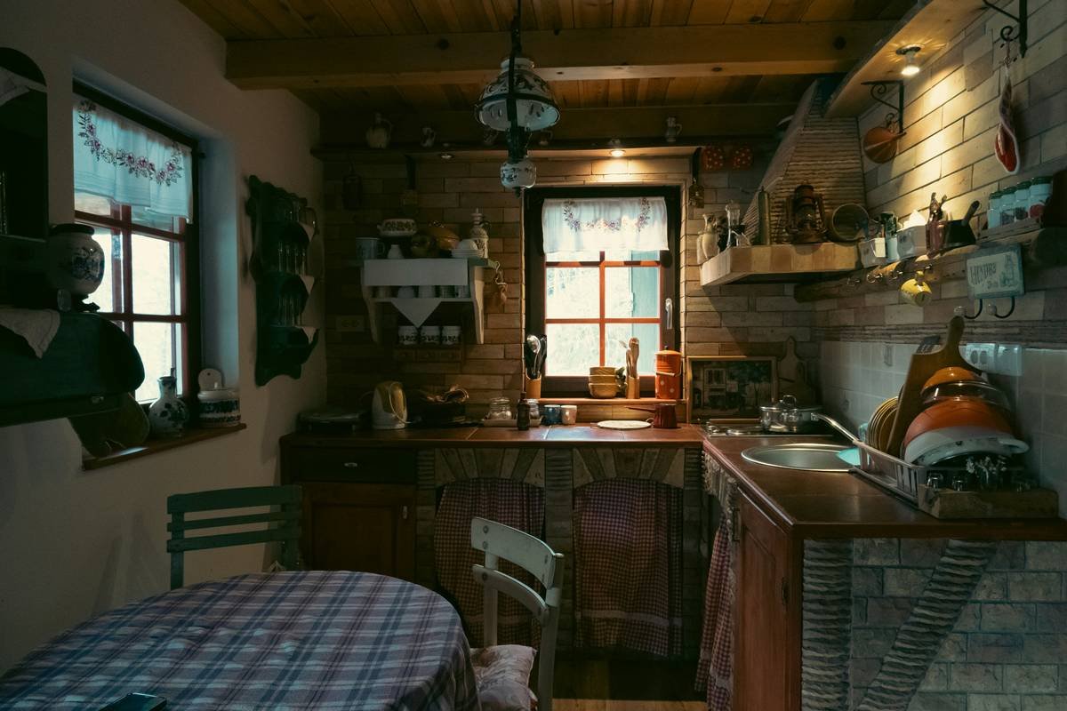 Interior of a charming heritage farmhouse with wooden beams and vintage furniture