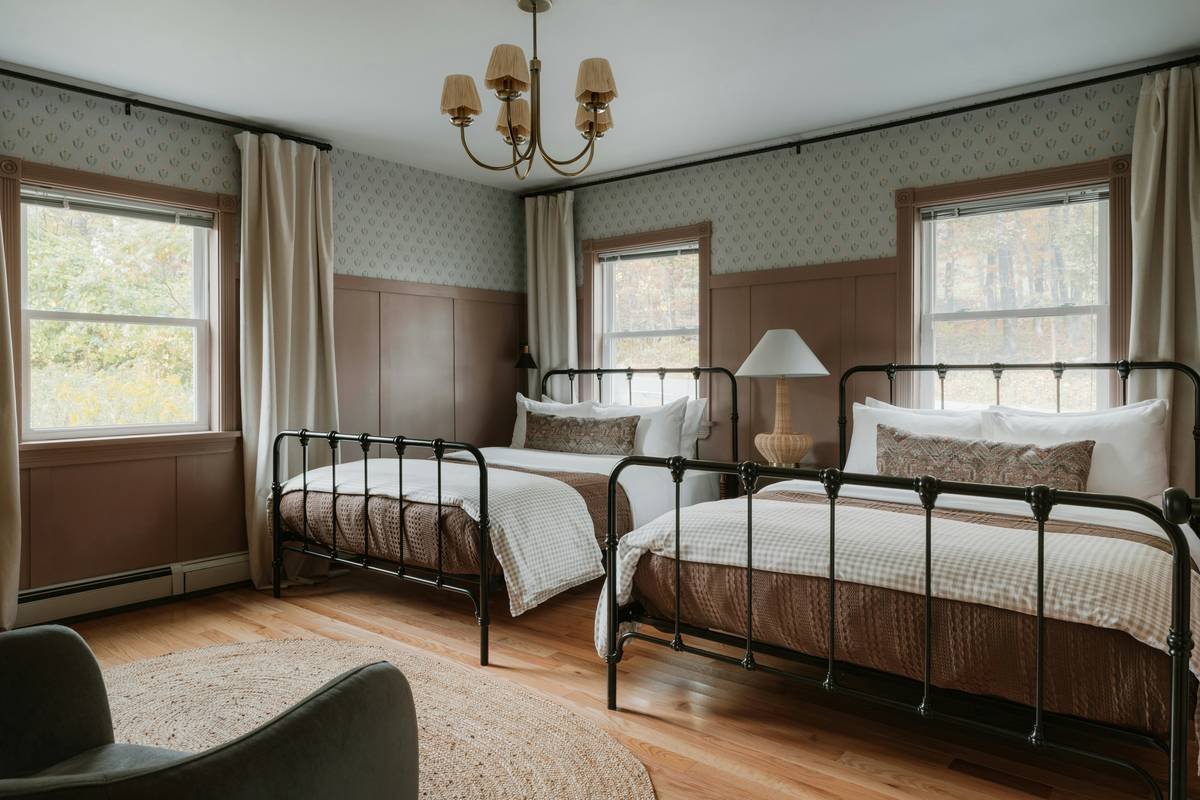 A cozy heritage apartment interior with vintage furniture, exposed beams, and warm lighting.