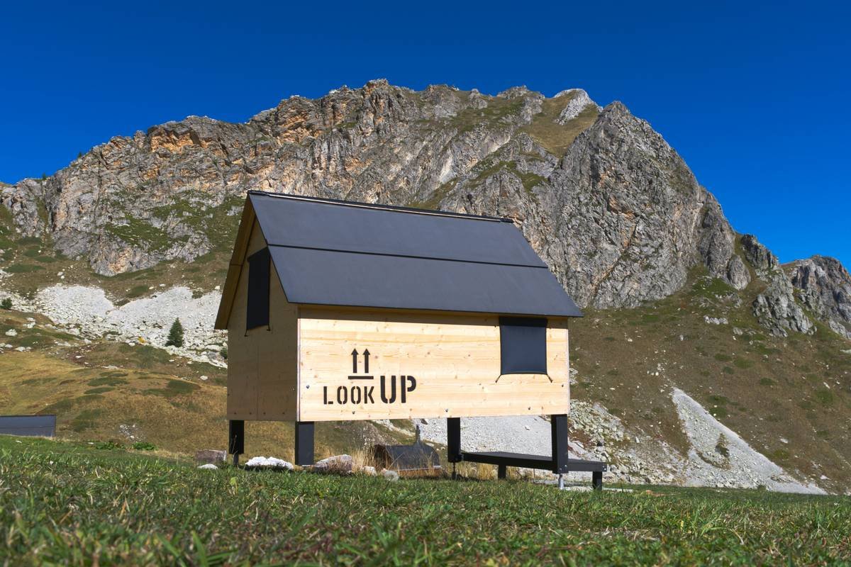 A cozy fireplace in a heritage vacation lodge with antique furnishings
