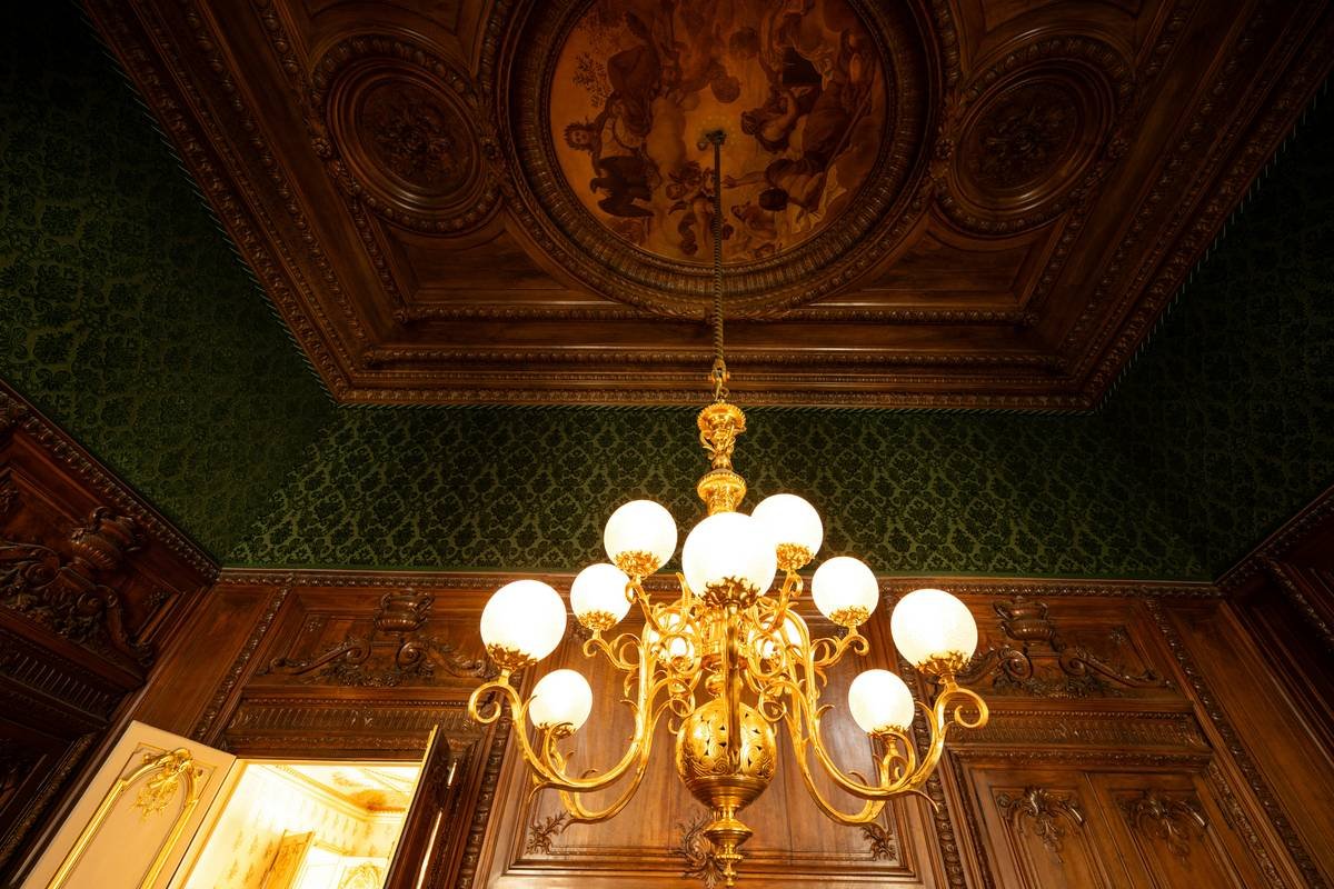 Side-by-side comparison: Left shows generic 'vintage' Airbnb with staged decor; right shows authentic historic rental with original wainscoting, fireplace, and period-appropriate furnishings.