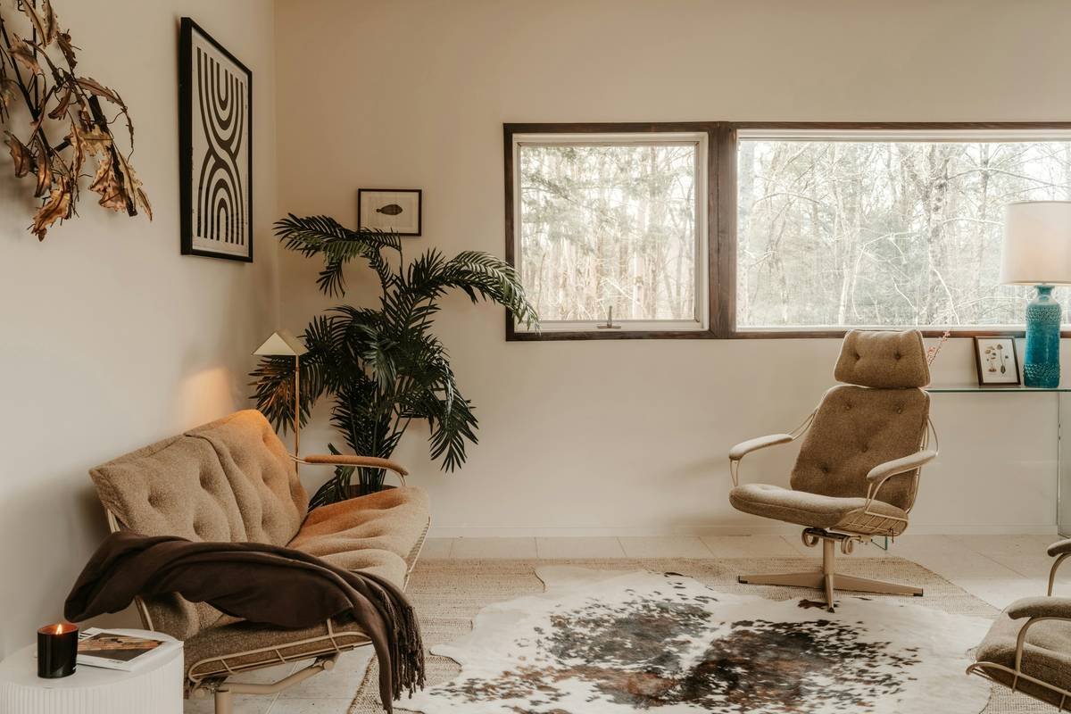 Side-by-side comparison: left shows a preserved 1930s kitchen with original enamel stove and linoleum; right shows same layout stripped bare with stainless steel appliances and subway tile
