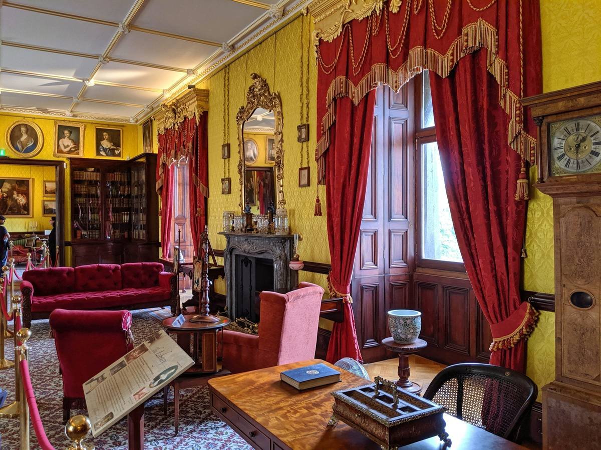 Side-by-side comparison: left shows a certified heritage suite with original plaster walls, antique fixtures, and documented history; right shows a staged 'vintage' rental with fake aged wood and modern drywall