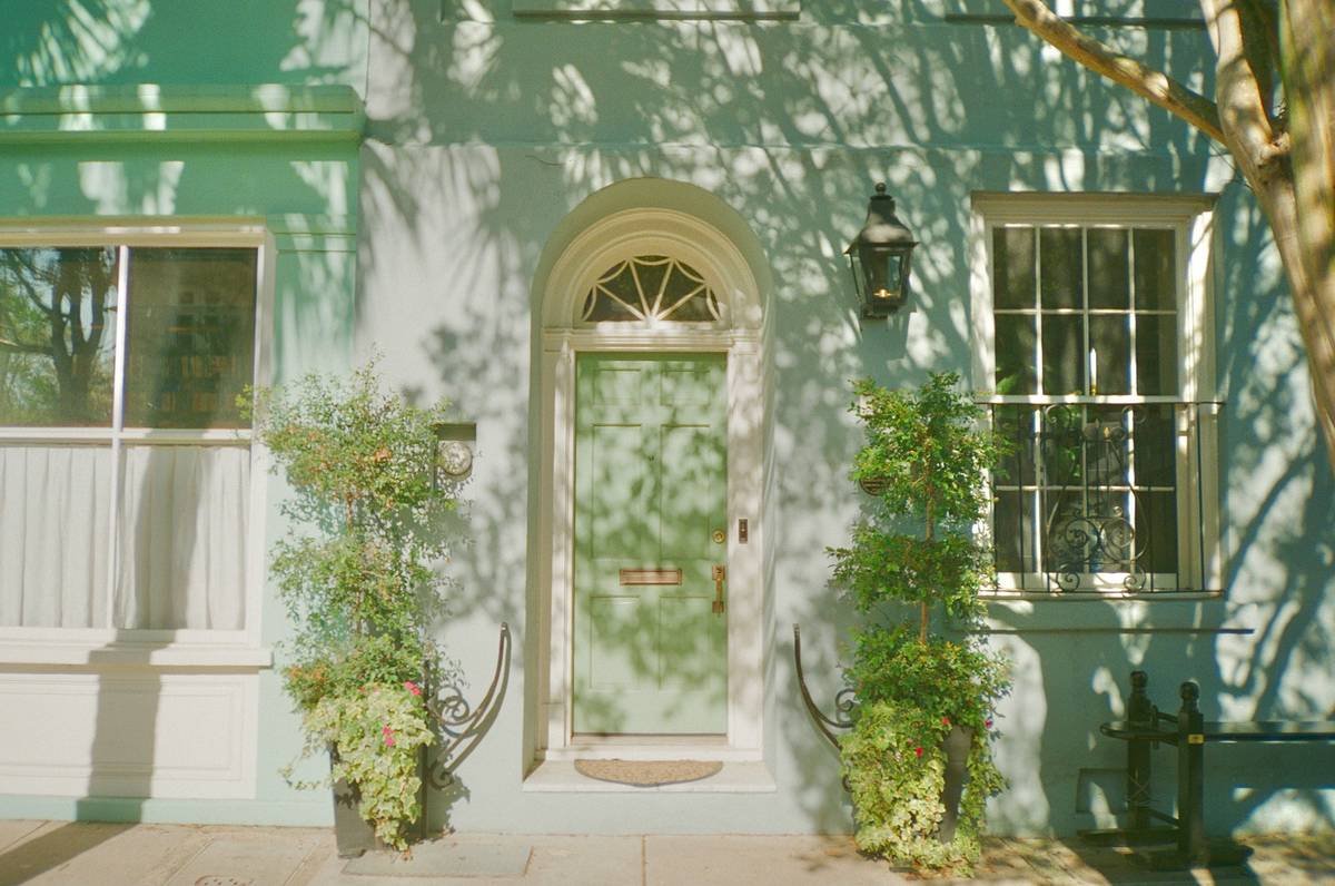 historic charleston vacation rentals featuring original heart-pine floors and gas lanterns on a cobblestone street