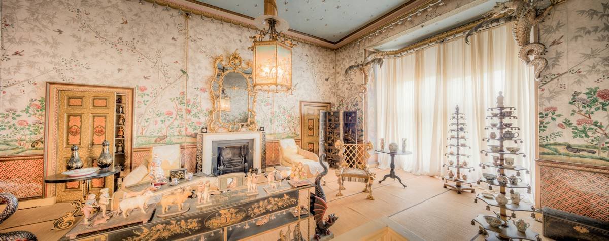 the vintage venue rental featuring exposed brick walls, antique furniture, and a working wood-burning stove in a restored European townhouse